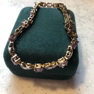Amethyst stone bracelet with silver inlet. Brand new.
